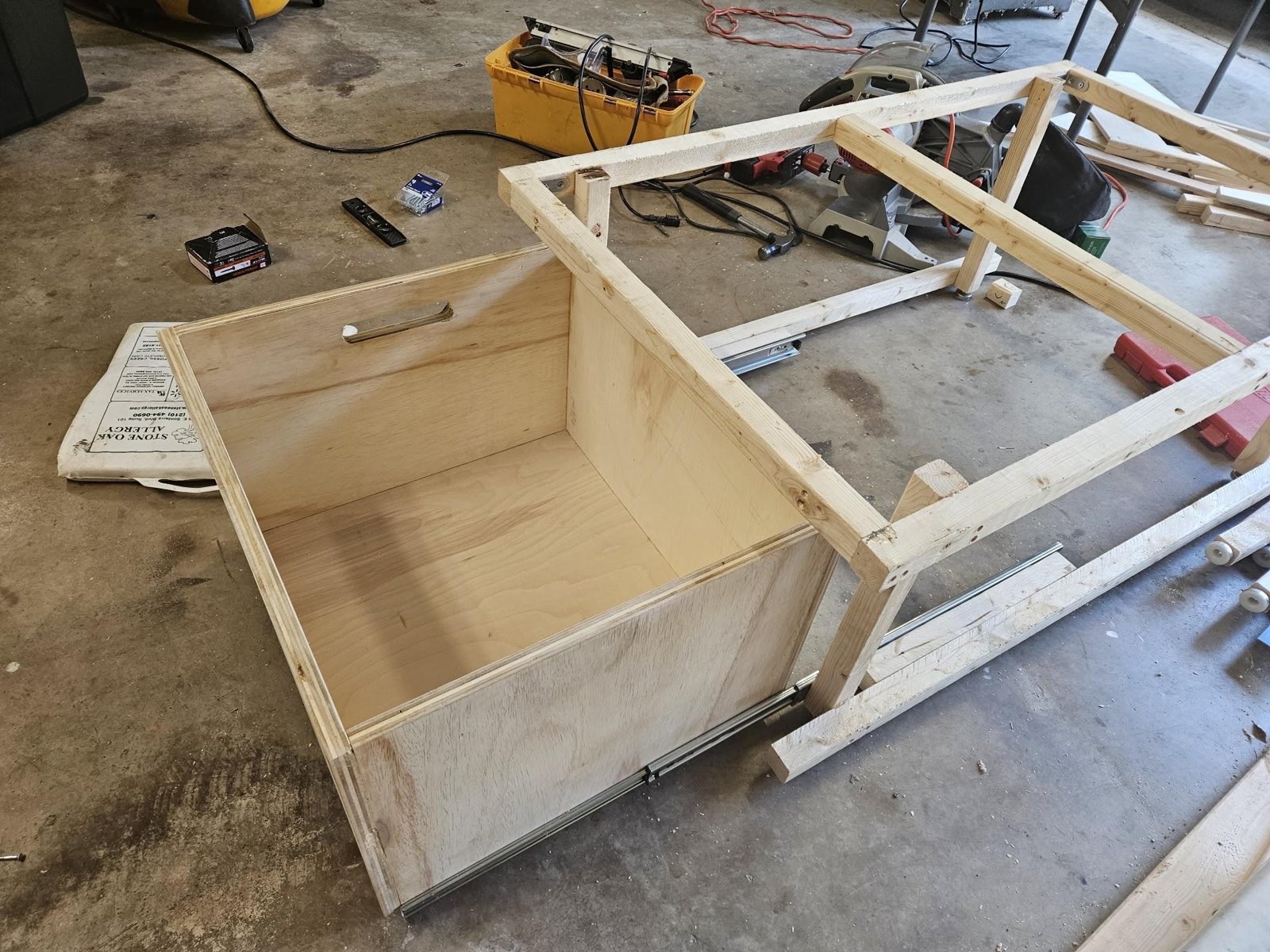 The drawer pulled fully out of the Panel A frame on full-extension metal slides